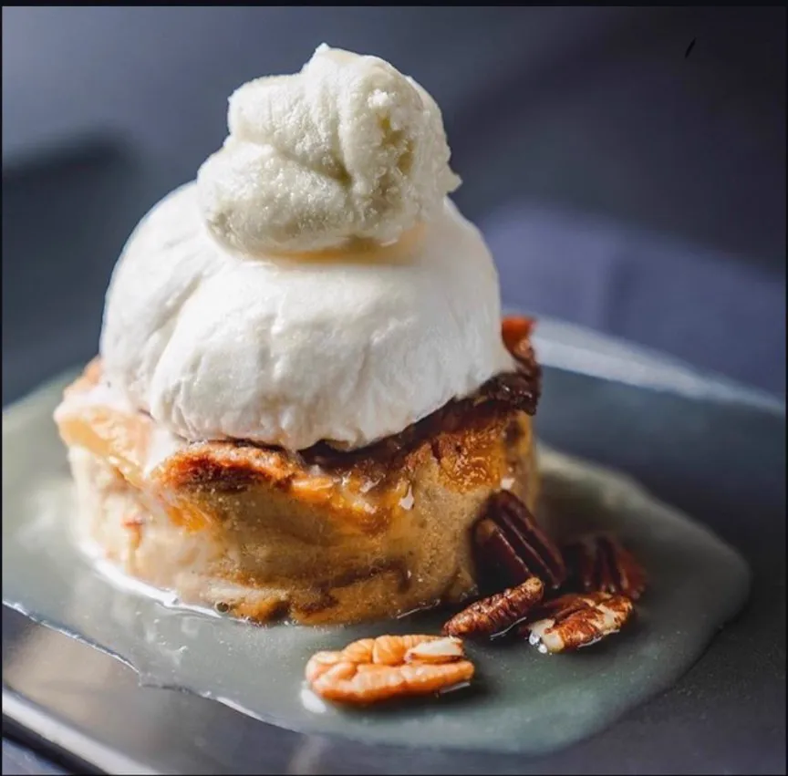 Bread pudding with vanilla ice cream and pecans